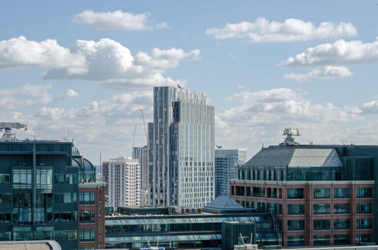 A city view with clouds in the sky.