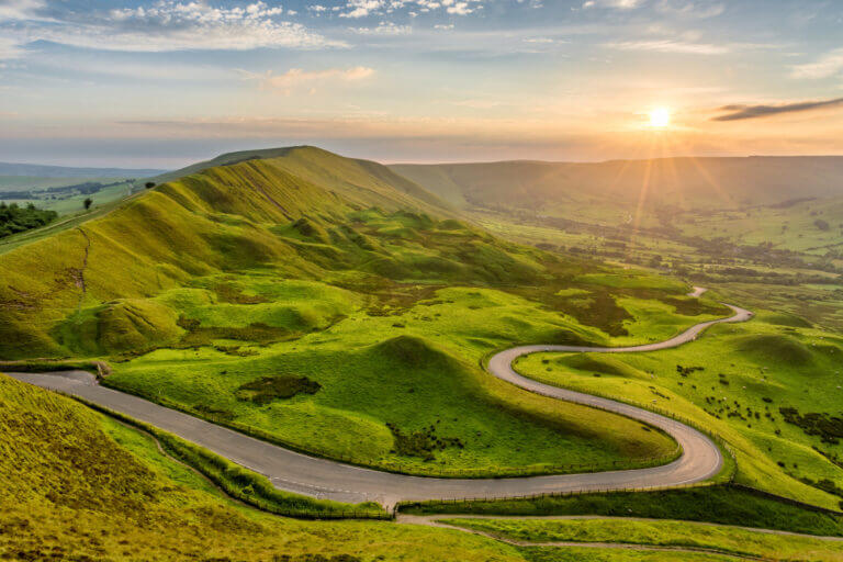 A green landscape with a road